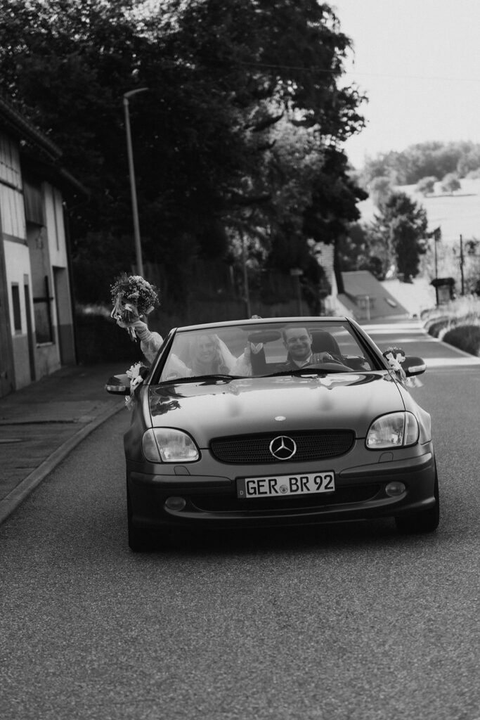 Newly weds driving in the car